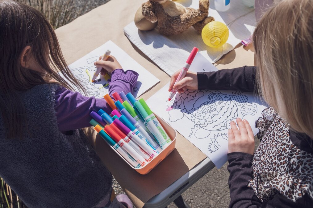 Photo by Alan Rodriguez on Unsplash Two little girls color with markers.