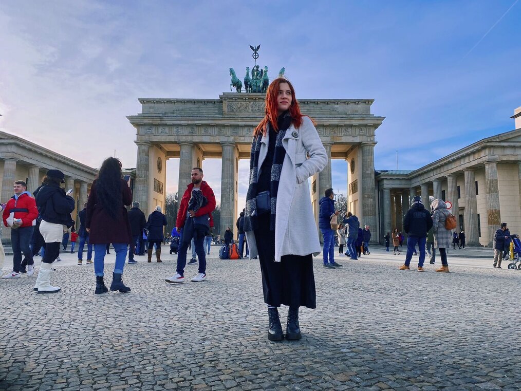 Creative Internship in Berlin with ABI A woman stands in a square in Berlin.