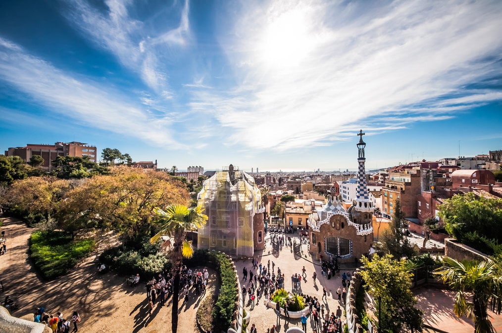 ITTT A drone shot of the city of Barcelona with a clear blue sky.