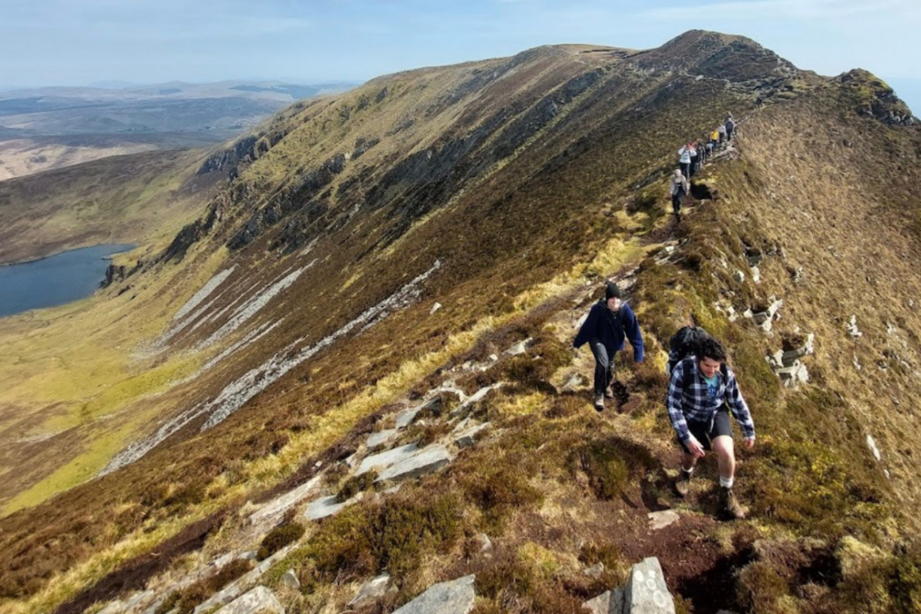 Group of people hiking on a hill