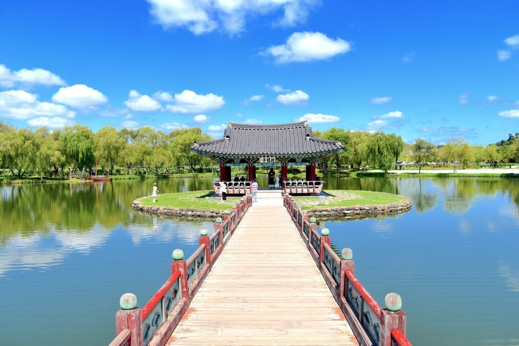 A bridge leading to a Korean pagoda.
