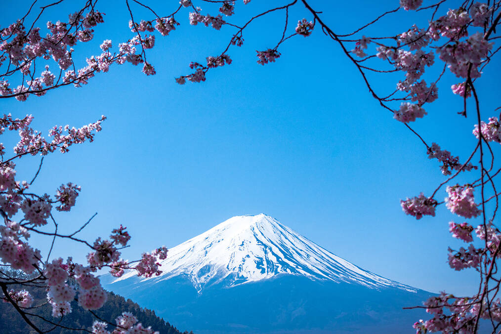 A photo of Mt. Fuji with a blue sky behind