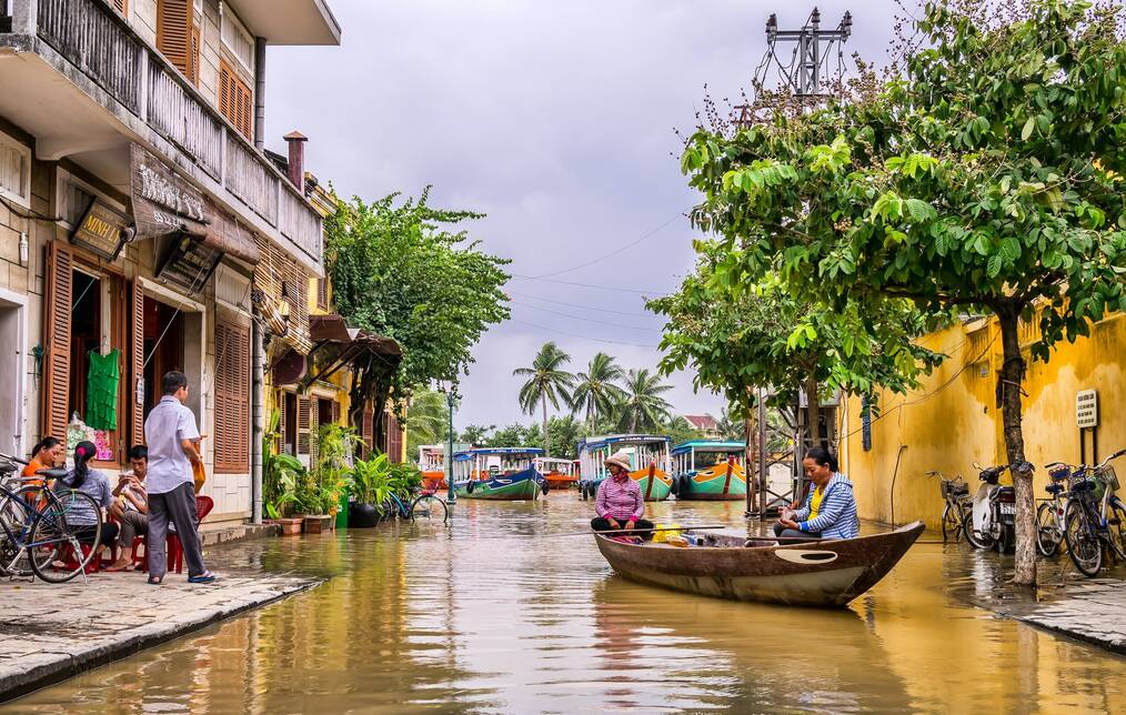 A boat navigates down a canal in Vietnam.