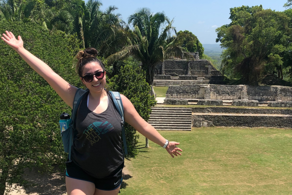 Traveler smiling holding hands up