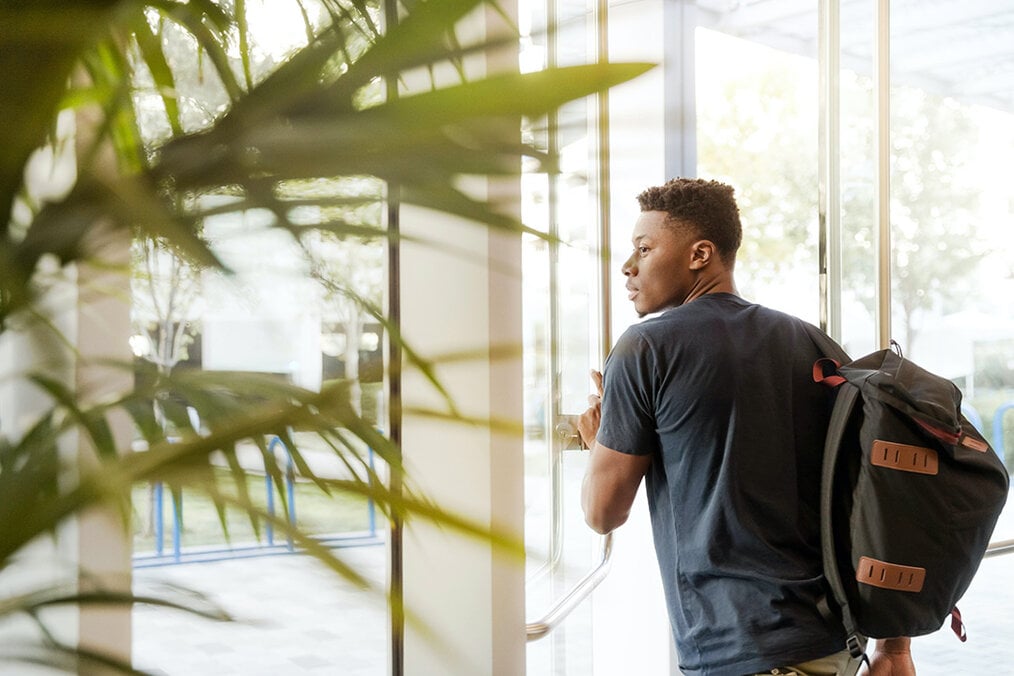 Student walking out the door