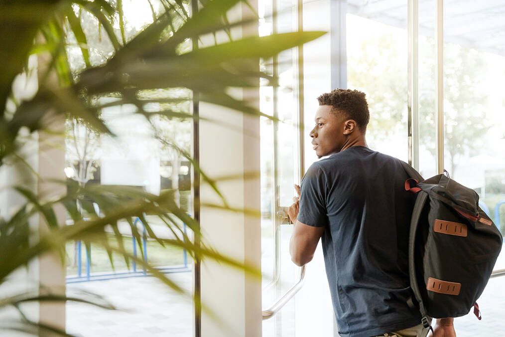 Student walking out the door