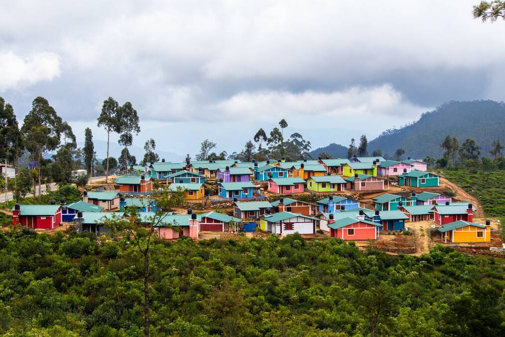 Colorful houses on lush green hill