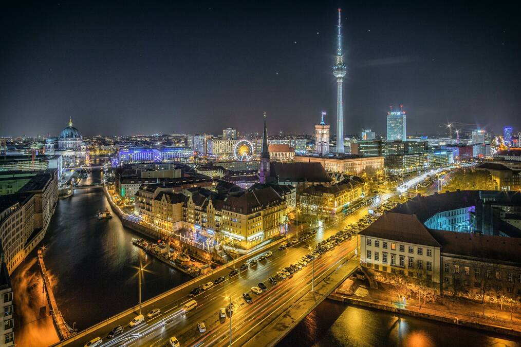 A drone view of Berlin at night.