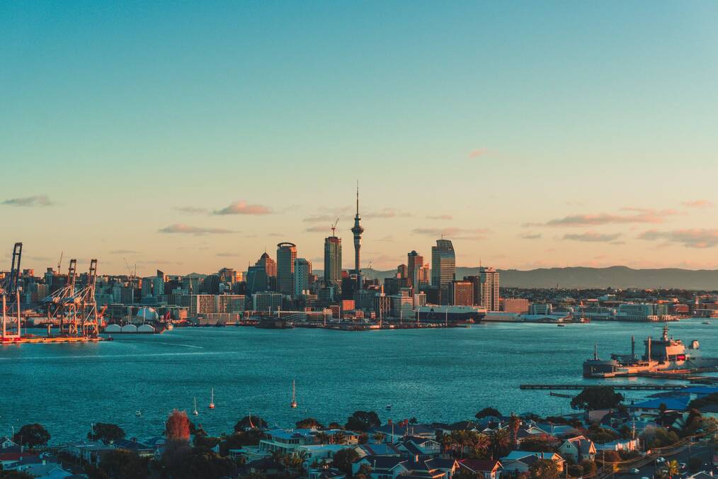 Auckland at sunset by the water.