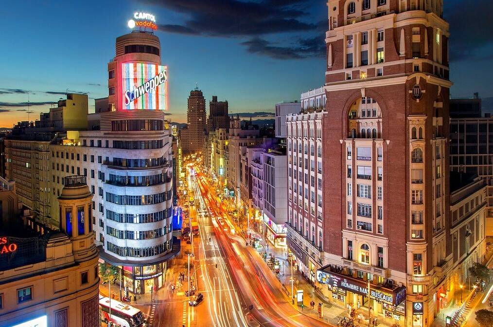 A drone view of Gran Via in Madrid at night.