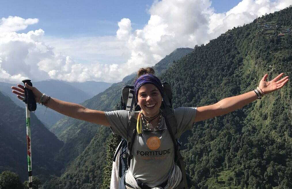 Girl backpacking on mountain.