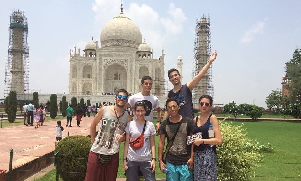 VolSol A group stands in front of the Taj Mahal.