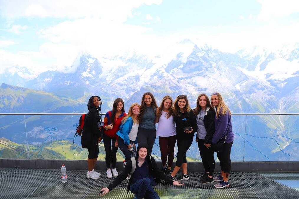 A group of gap year travelers in front of a mountain 