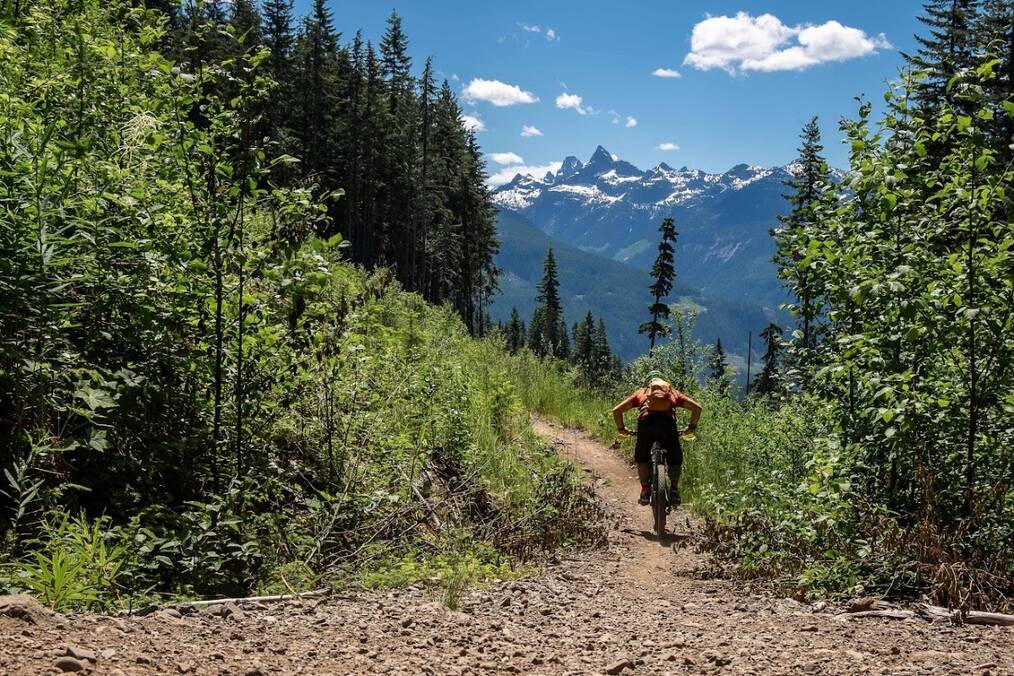 A person biking through mountainous terrain