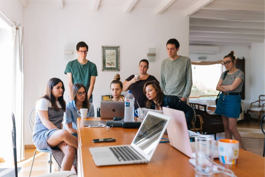 A group of interns working in the office