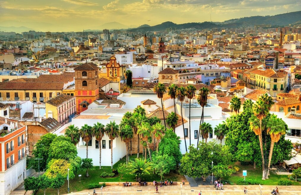Unsplash Barcelona A view of buildings and palm trees in Barcelona.