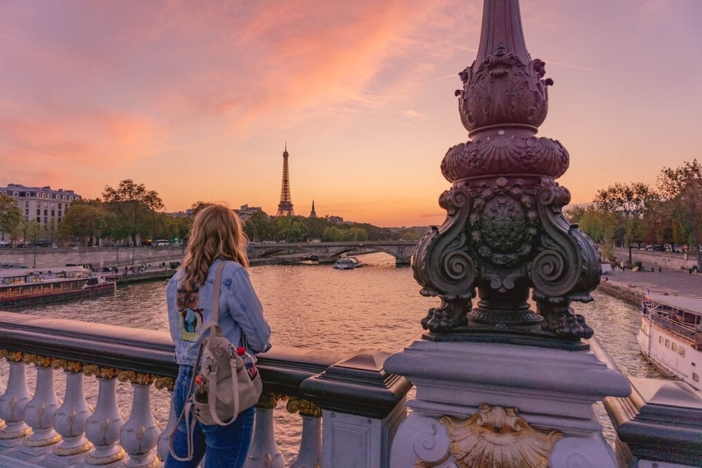 French scenery A person staring out towards the Eiffel Tower in Paris, France