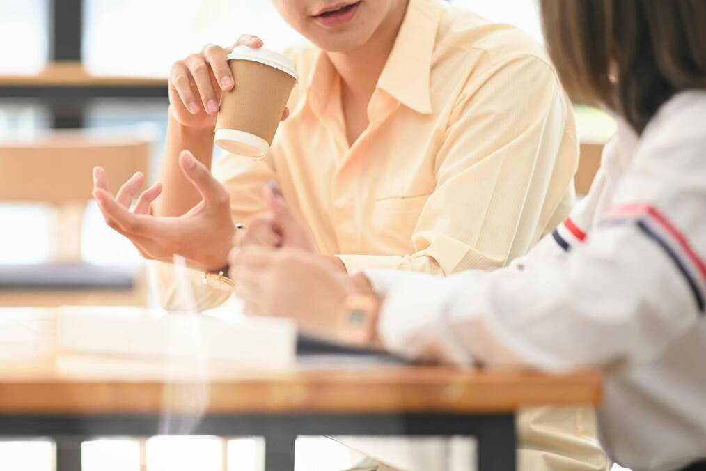 A teacher talking to their student