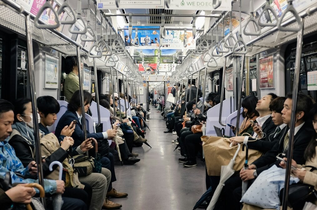 Photo by Alex Eckermann on Unsplash A busy subway car in Japan.