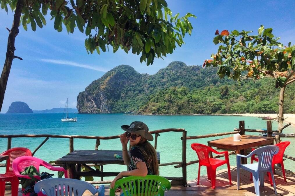 A person sat by a table on Thai islands 