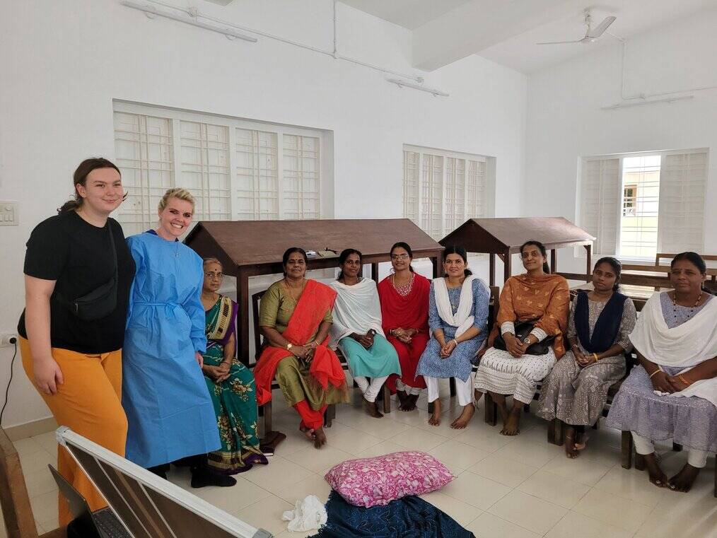 Women attend a first aid training in India.