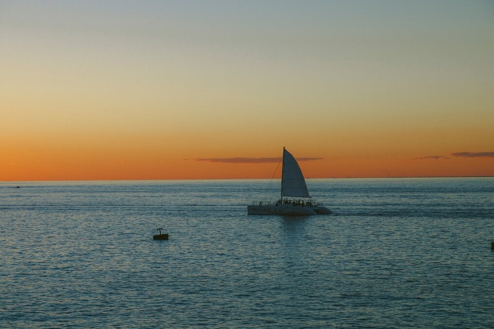 Sail volunteering abroad A boat sailing during a sunset