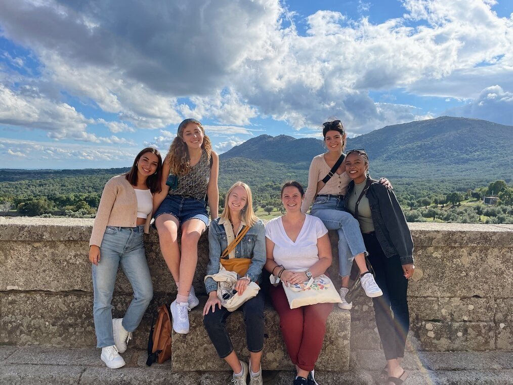 CIEE A group of friends pose for a photo with mountains in the background.