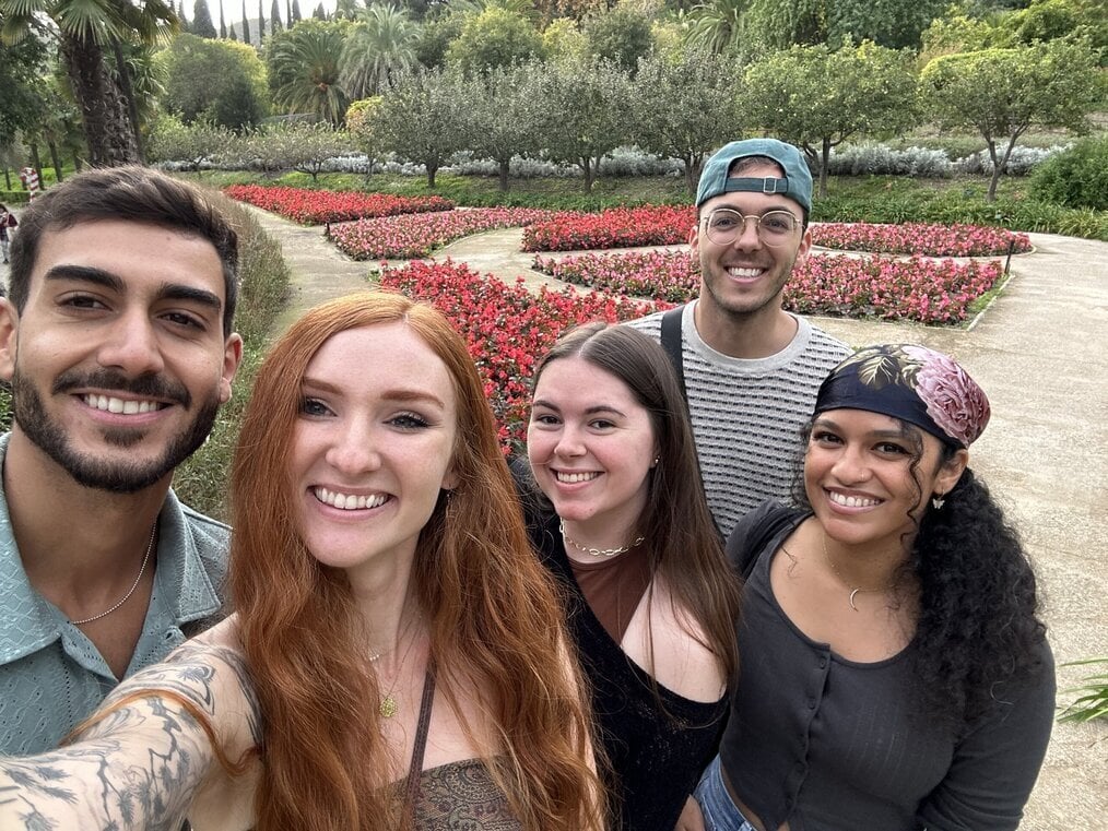 RVF friends A group of friends take a selfie in a garden and smile.