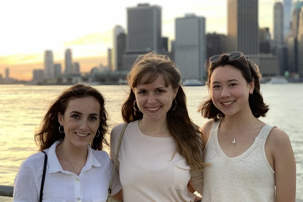 Sally F., Artbound Internship NY 1 Three friends standing on a waterfront in a city