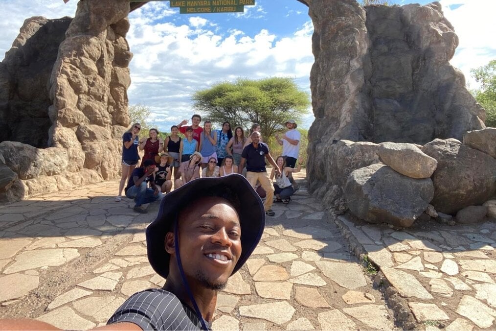 Gabriella T, Volunteer Abroad, GIVE, Tanzania A person taking a selfie with a group of friends in the country