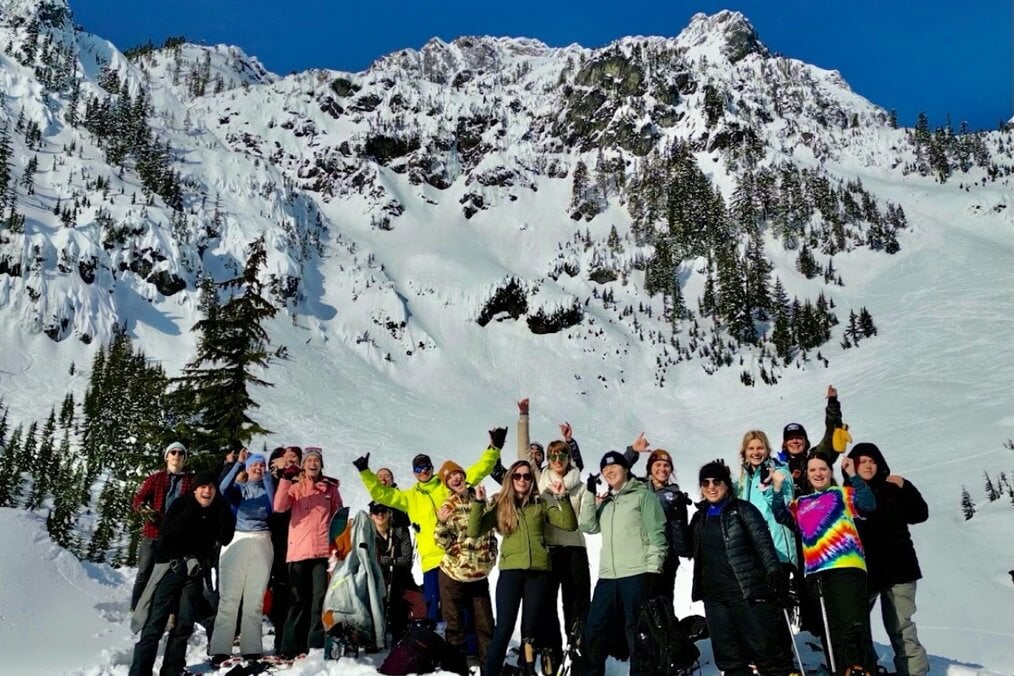 Ski season abroad A group of people near a snowy mountain