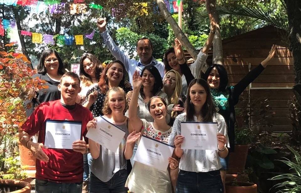 A group of teachers celebrating qualification 