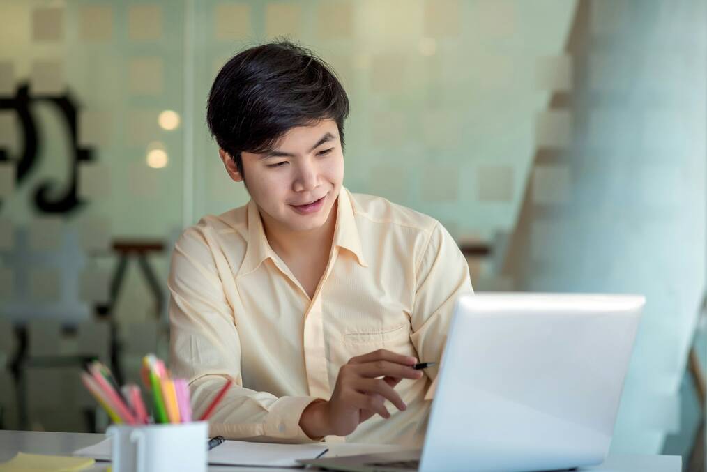 Man working on laptop in an office