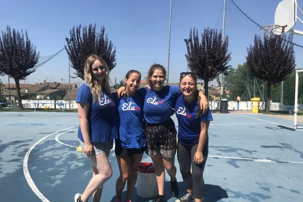 A group of people in uniform posing and smiling