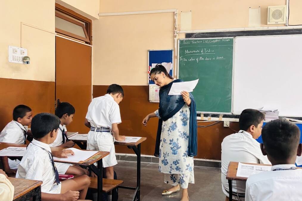 A teacher conversing with their student