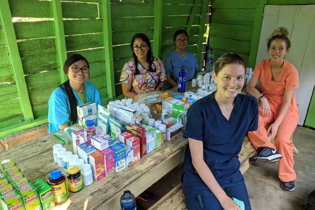 Volunteers working with local medical professionals