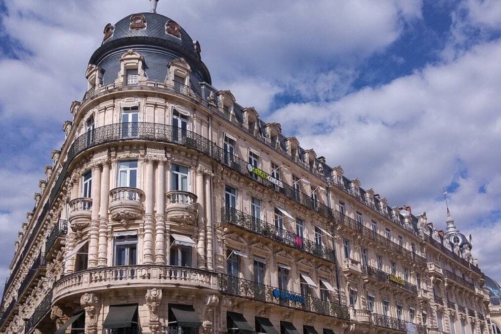 French architecture under a cloudy sky