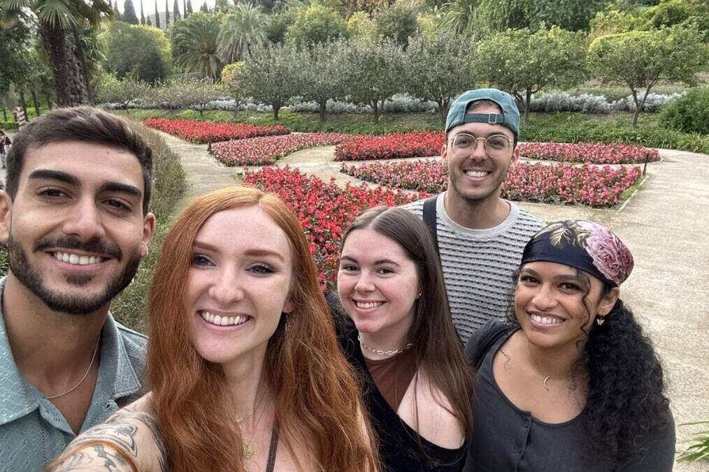 A group of friends in a flower garden 