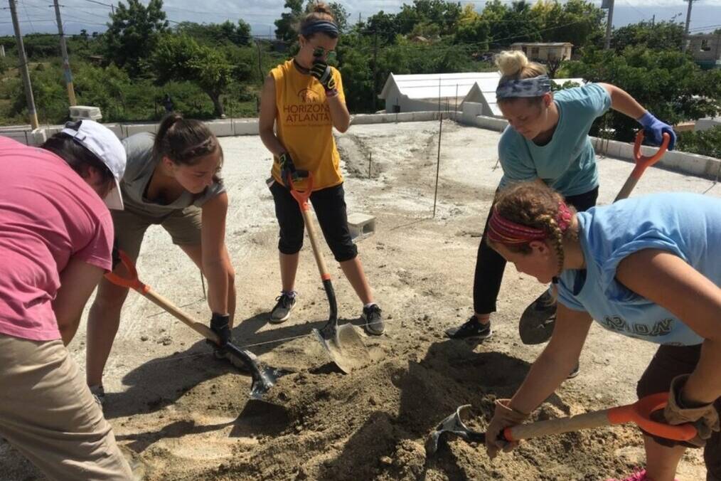 A group of volunteers digging