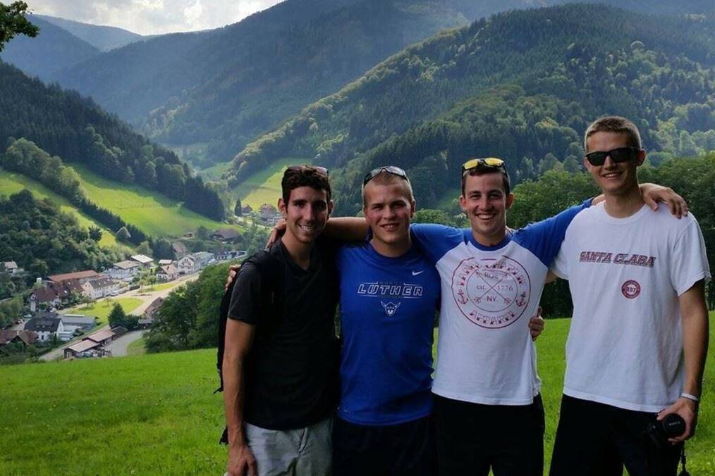 A group of friends smiling in the hills of Freiburg, Germany