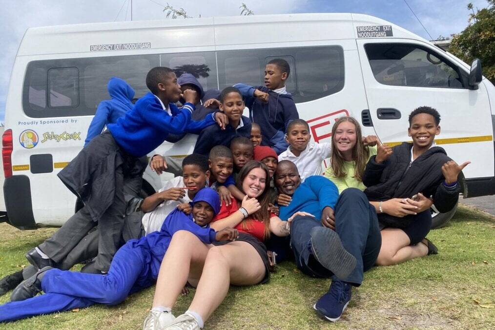 A volunteer with their students 