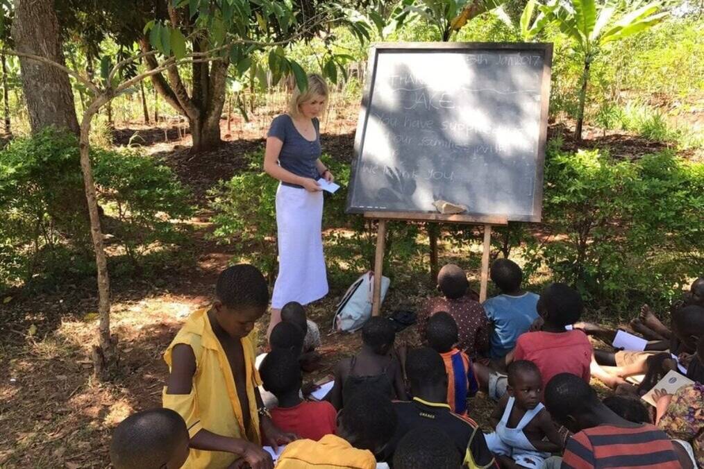 A teacher leading an outdoor classroom