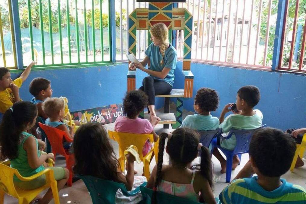 A person teaching a group of children