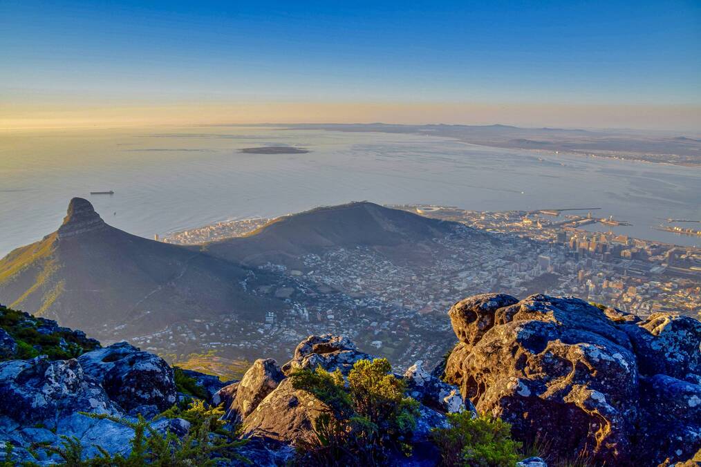 A view of a coastal city from the mountains