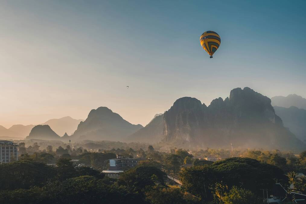 A hot air balloon over a mountainous landscape