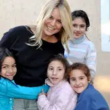 Female volunteer with children in a care project in Argentina