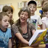 woman teaching kids