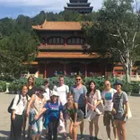 group in front of chinese building