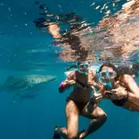 girls underwater snorkeling