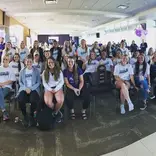 All girls sitting and smiling